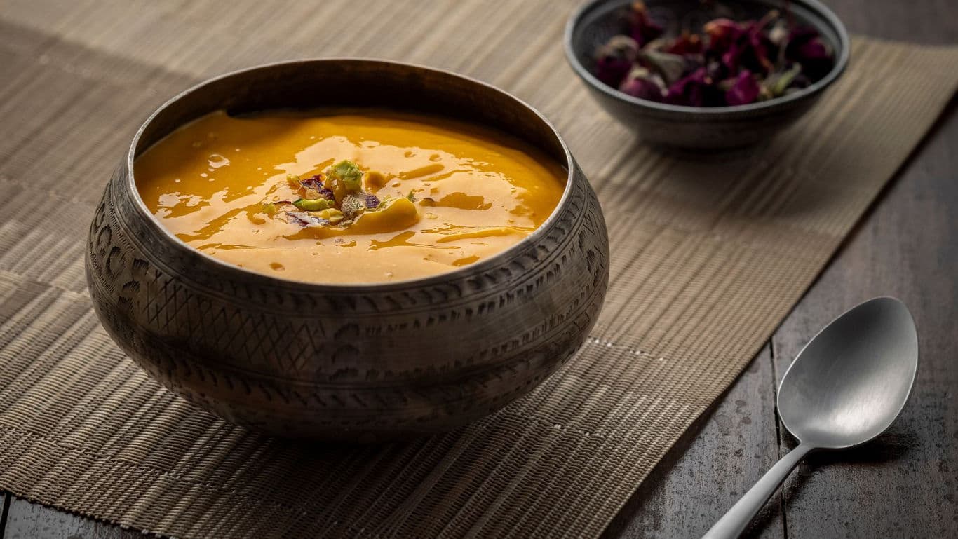 Traditional Indian Mango Dessert in Metal Bowl