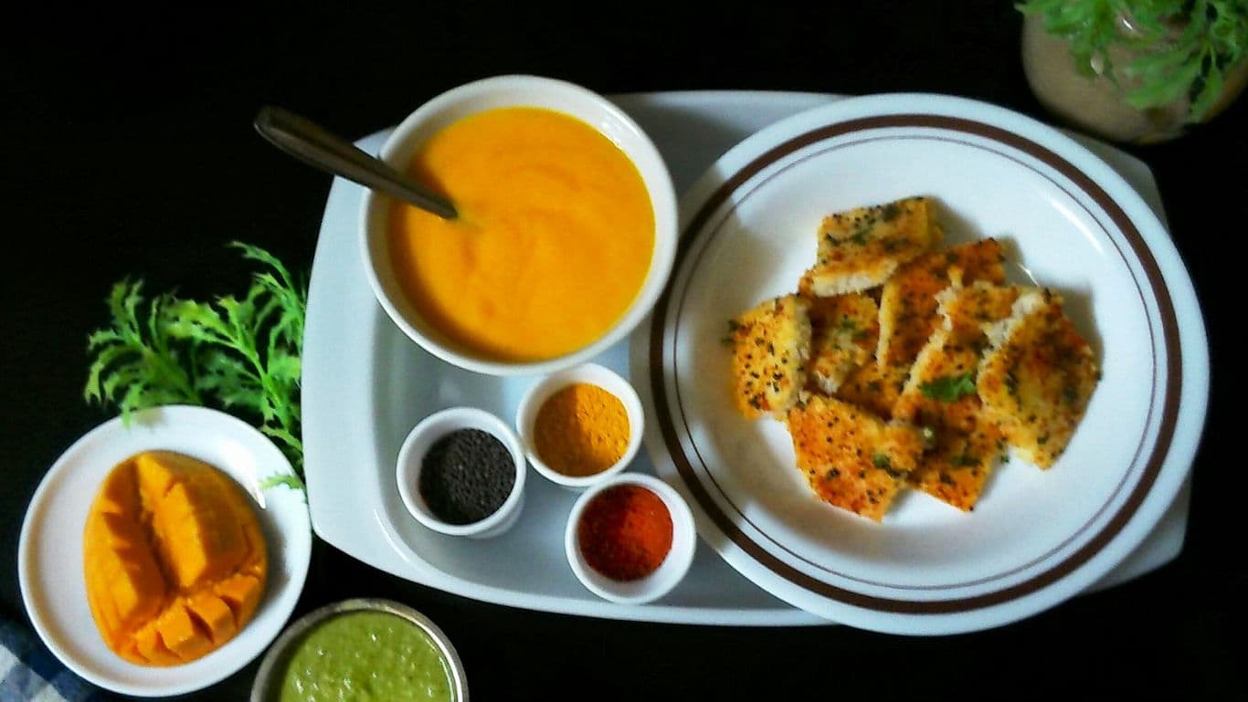 Colorful Indian snack platter with chutneys