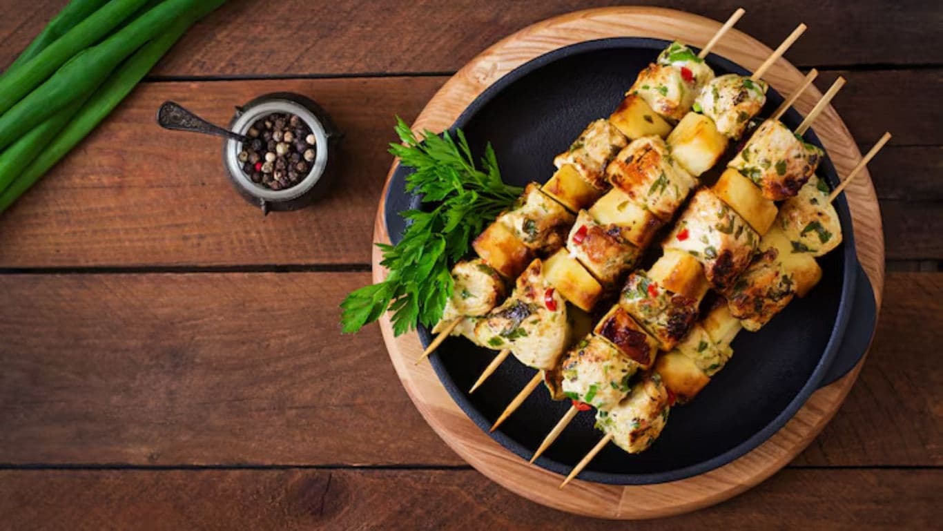 Grilled chicken and vegetable skewers on plate