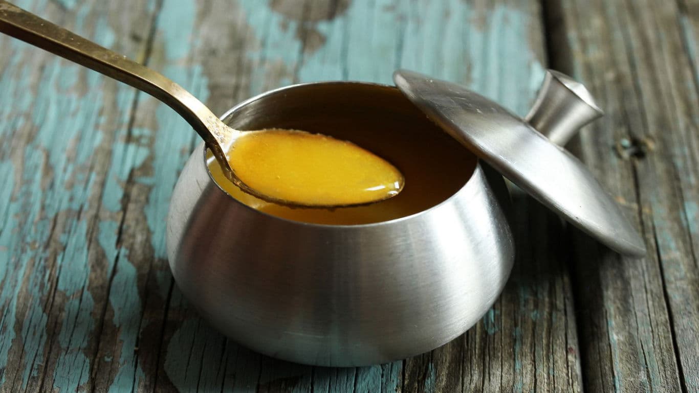 Golden sauce in stainless steel pot