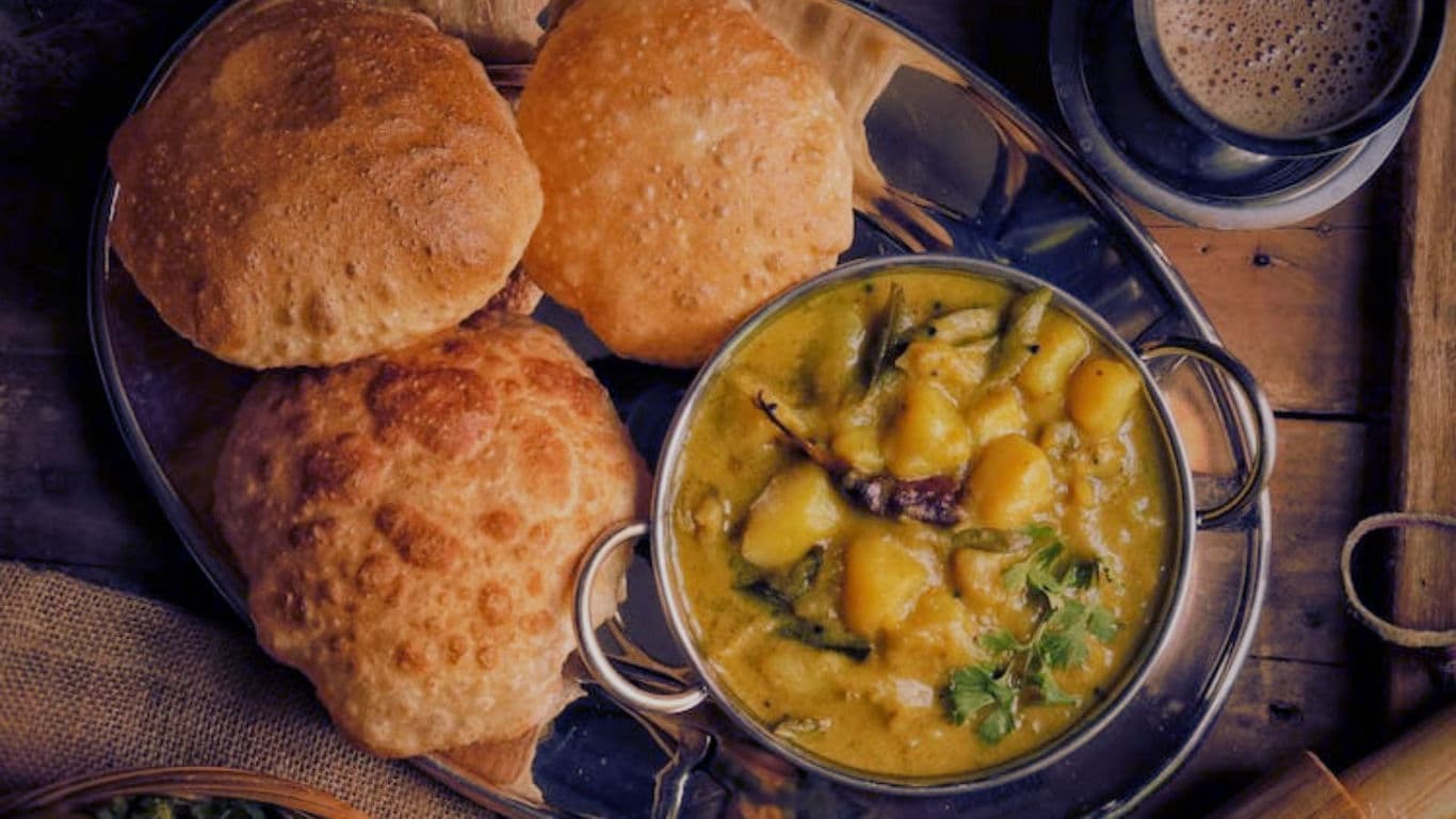 Traditional Indian Poori with Potato Curry Meal