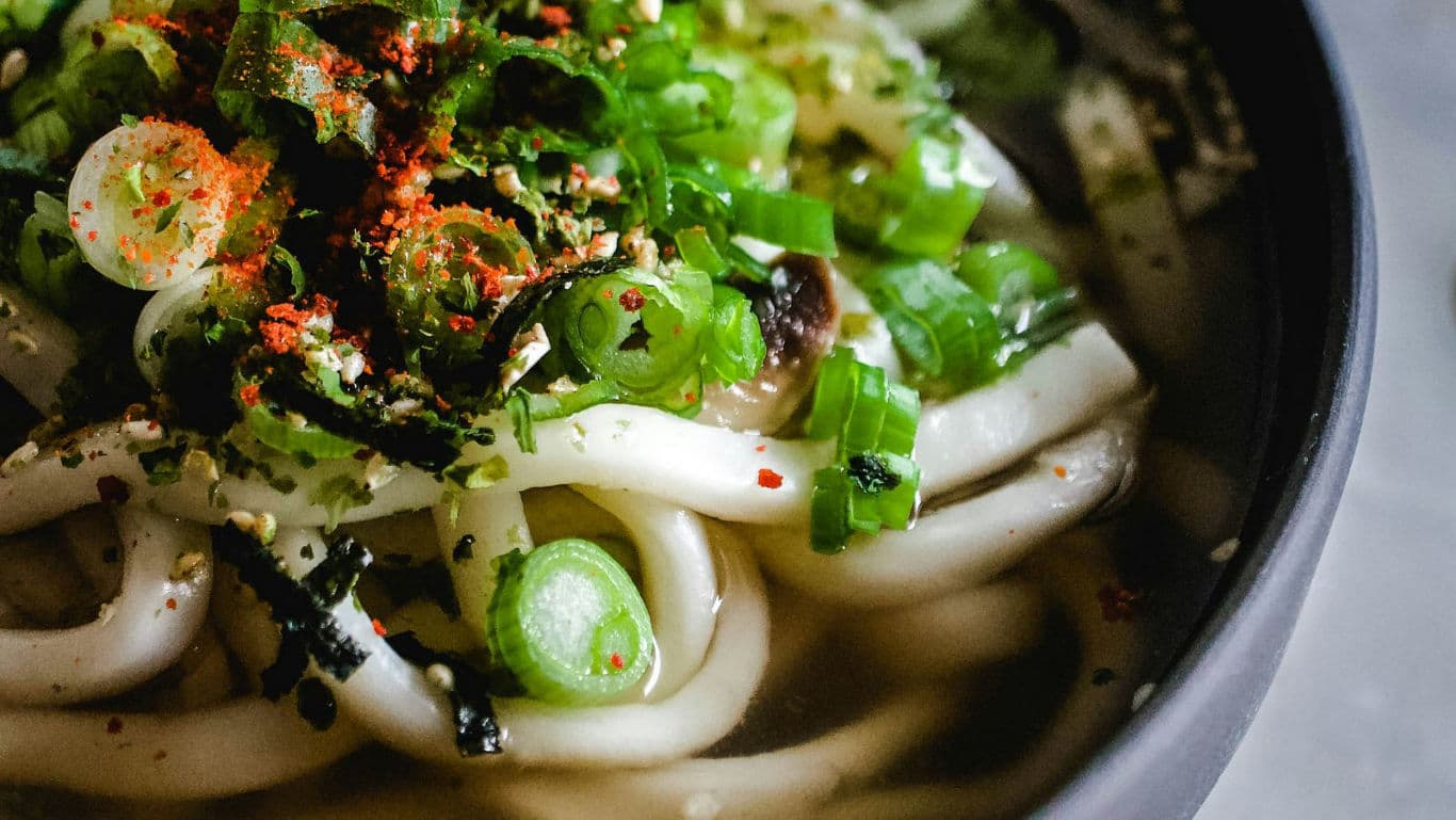 Close-up of Udon Noodle Soup with Scallions