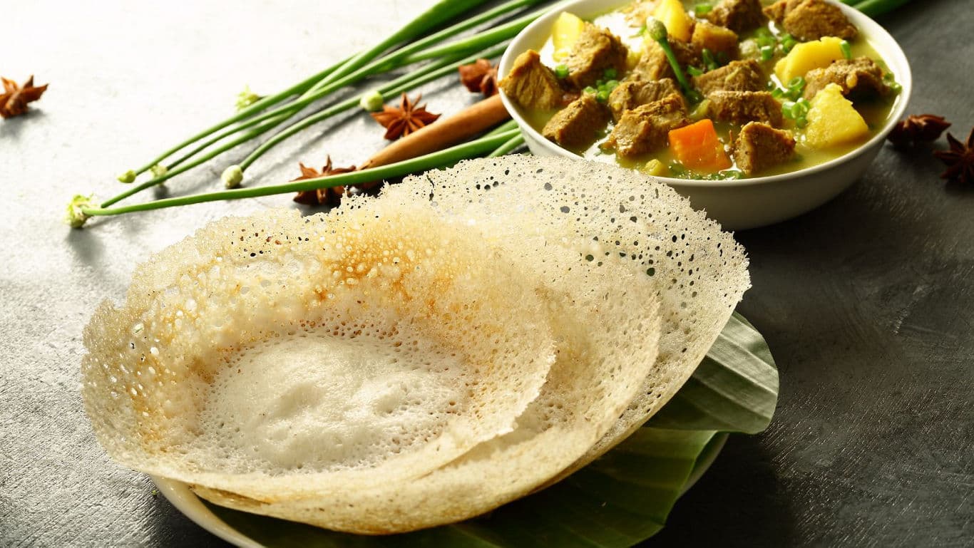 Appam with South Indian Curry on Banana Leaf