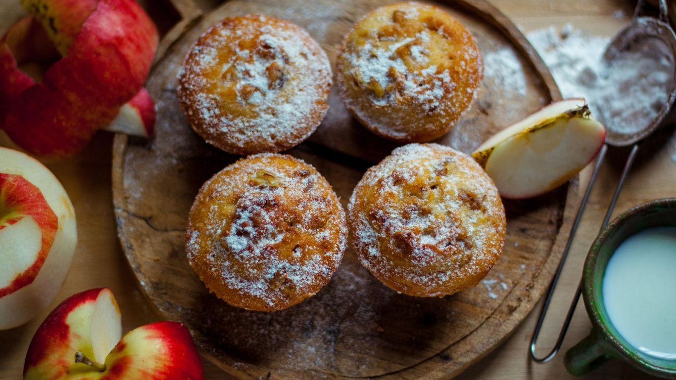 Apple sitting on top of a stack of books