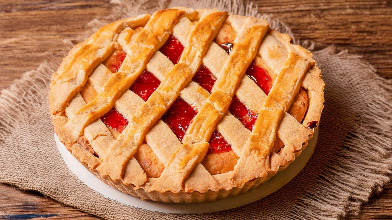 Apple sitting on top of a stack of books