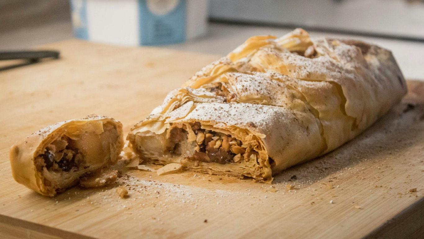 Apple sitting on top of a stack of books