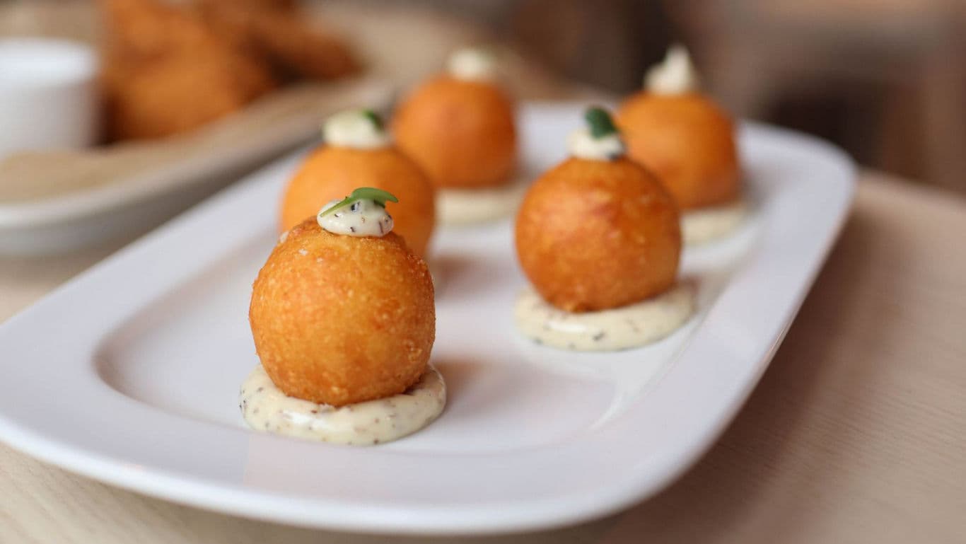 Gourmet fried cheese balls with dipping sauce