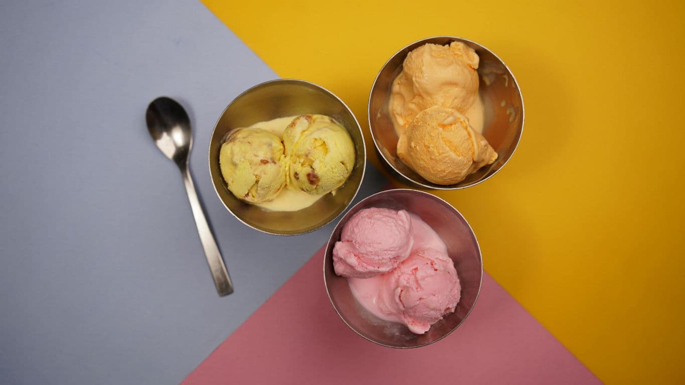 Three Bowls of Ice Cream on Colorful Background