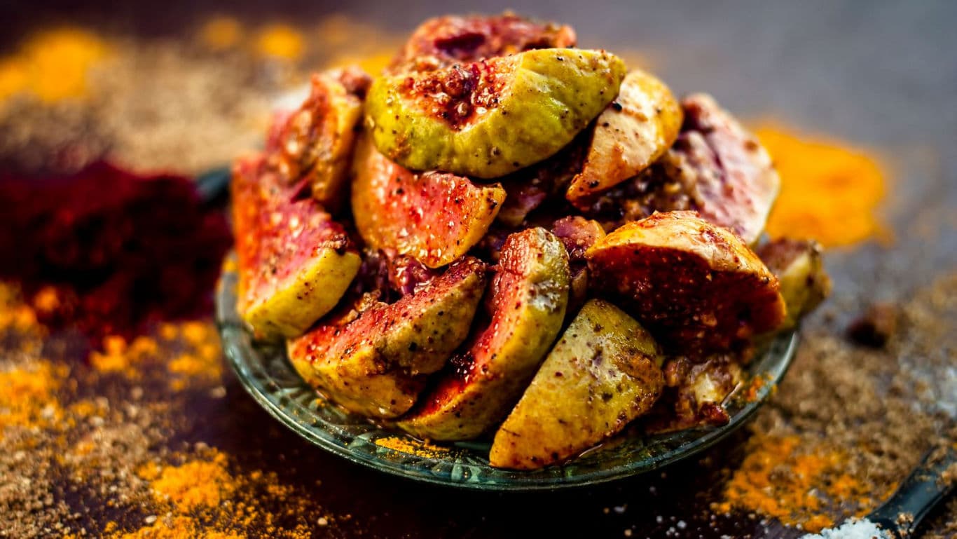 Spiced guava slices served on glass plate