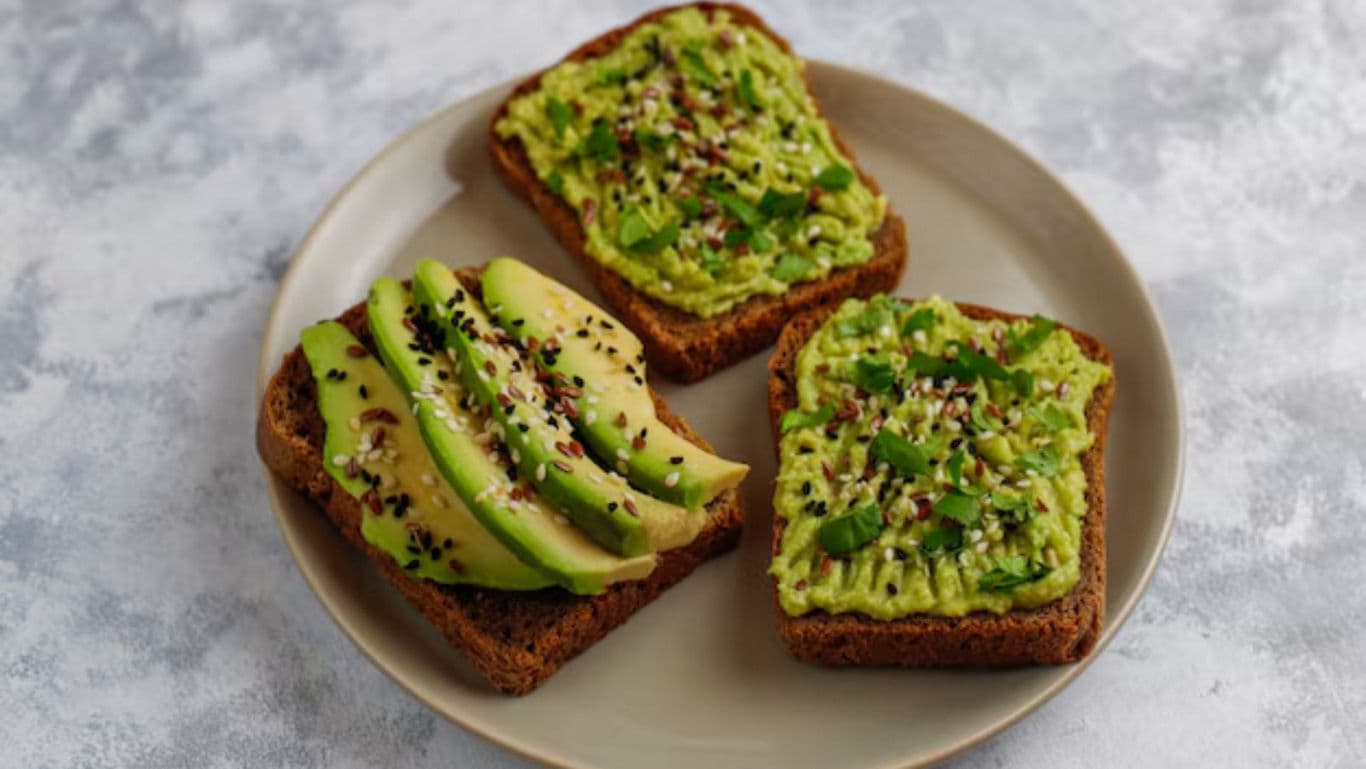 Avocado toast with sesame seeds on plate