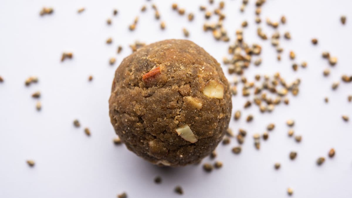 Single laddoo on a white background