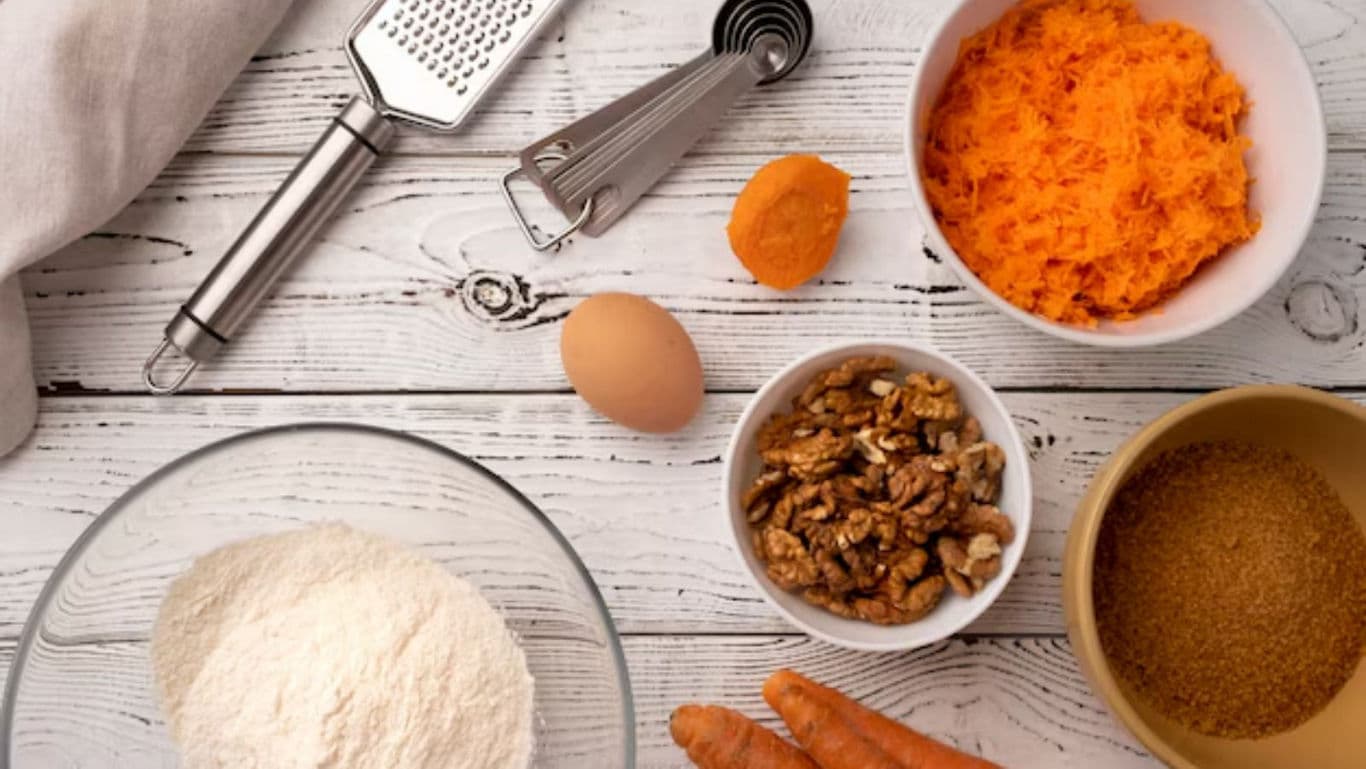 Carrot cake baking ingredients on rustic table