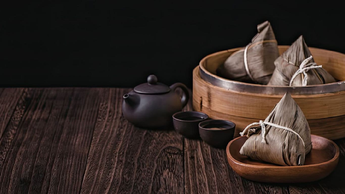 Traditional Chinese tea set with zongzi dumplings