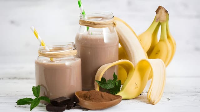 Banana-cocoa soy smoothie in jars