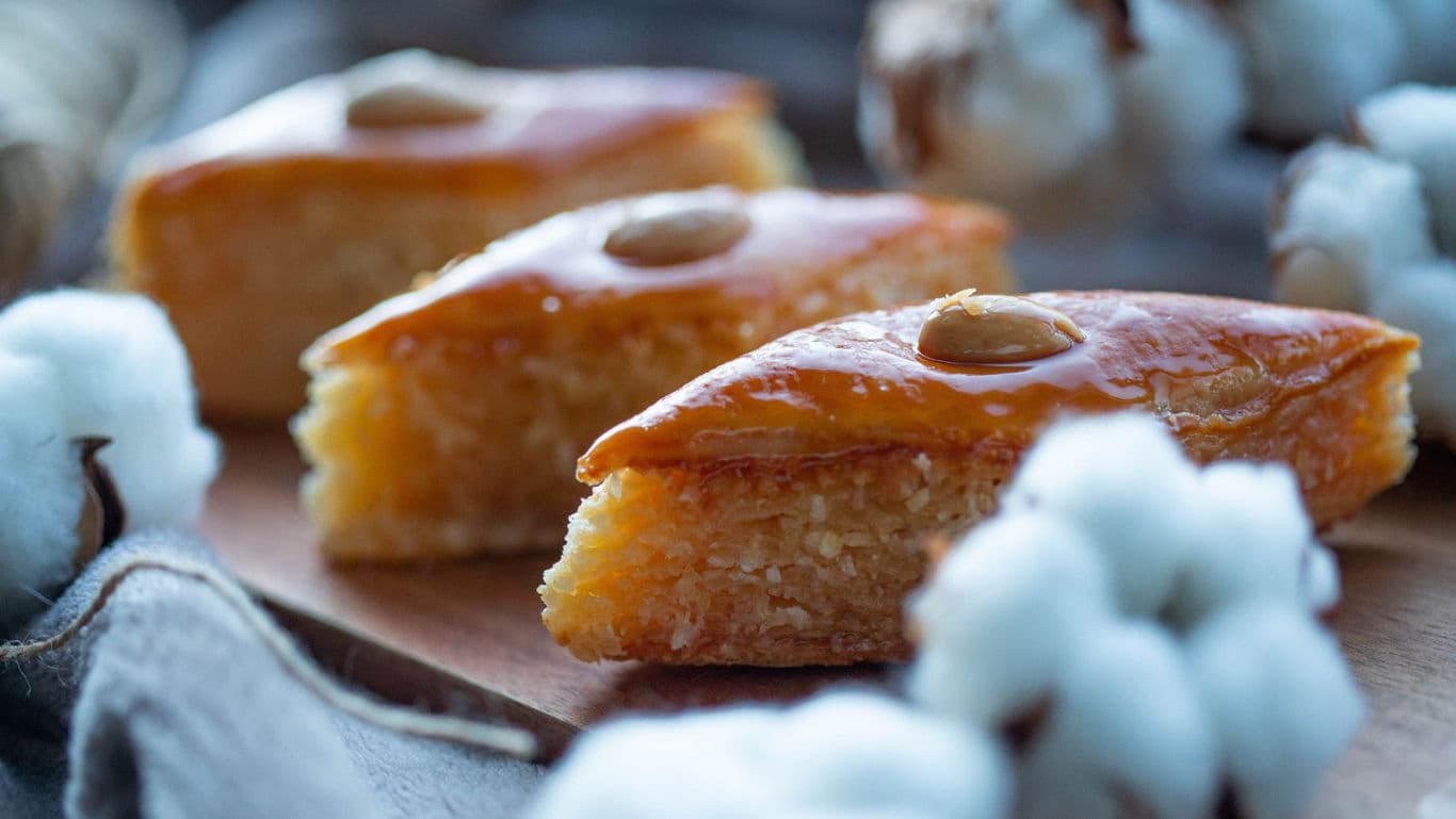 Traditional almond pastry slices on wooden board