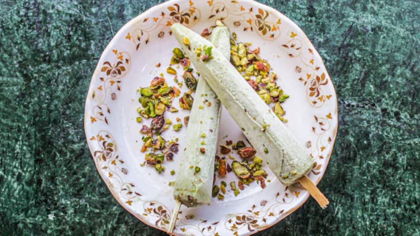 Traditional Indian Kulfi Popsicles with Pistachio Garnish