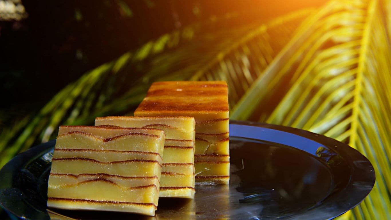 Layered cake slices on a plate outdoors