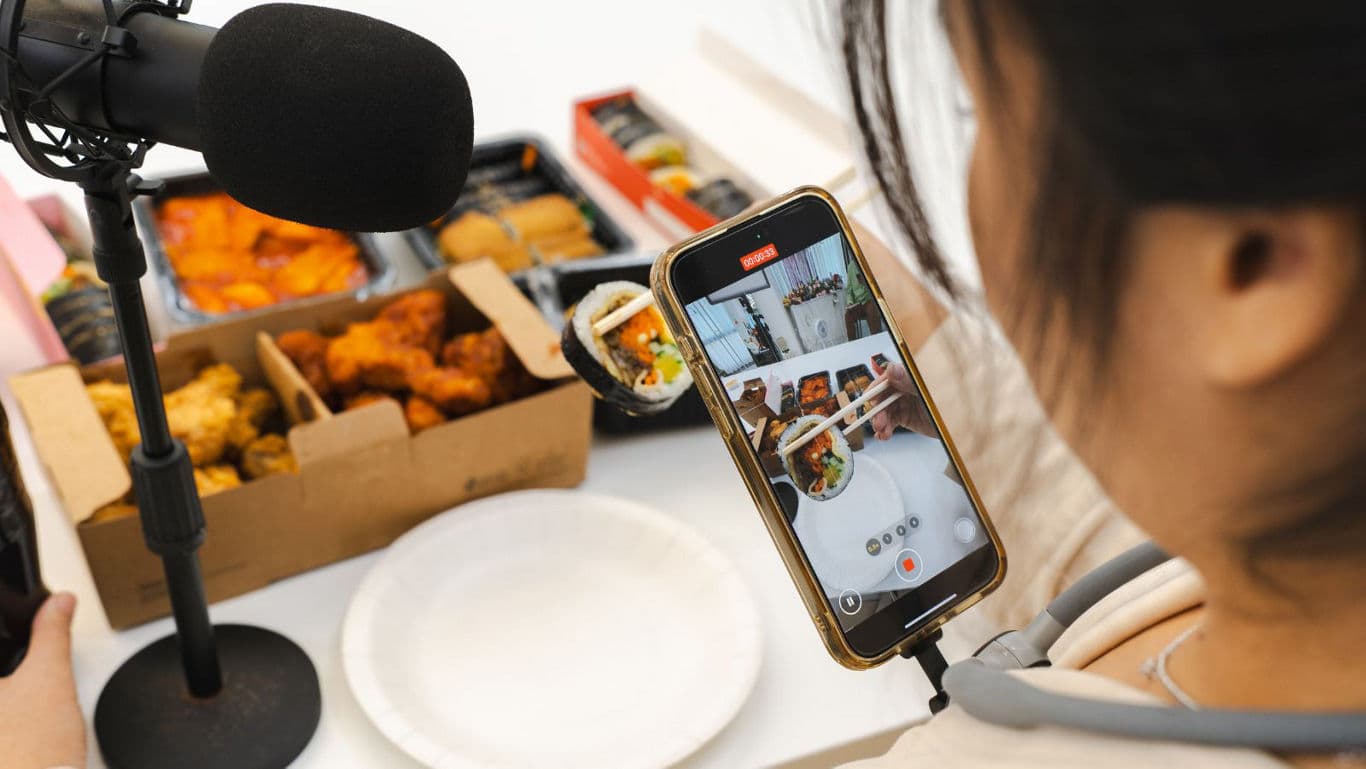 Food Blogger Filming Food Content On Phone