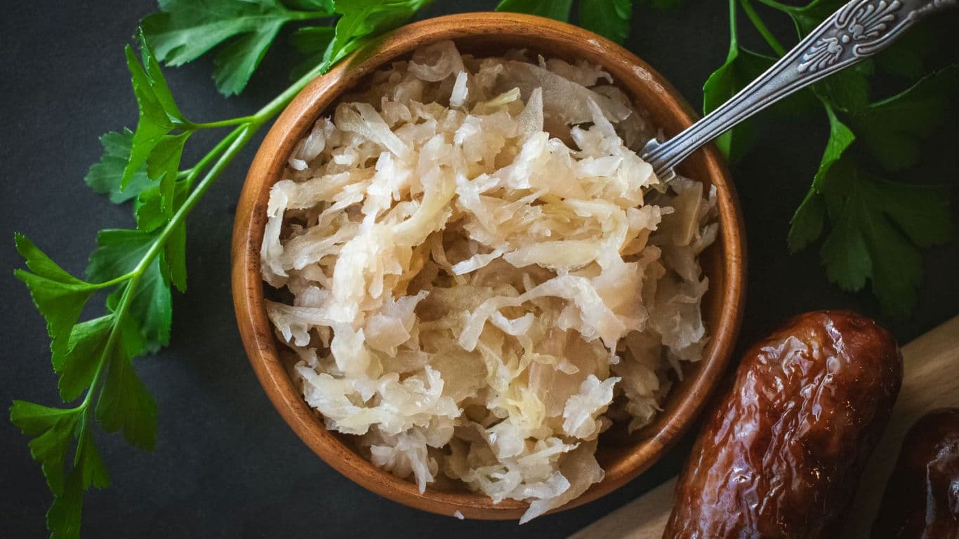 Bowl of Sauerkraut with Sausage and Herbs