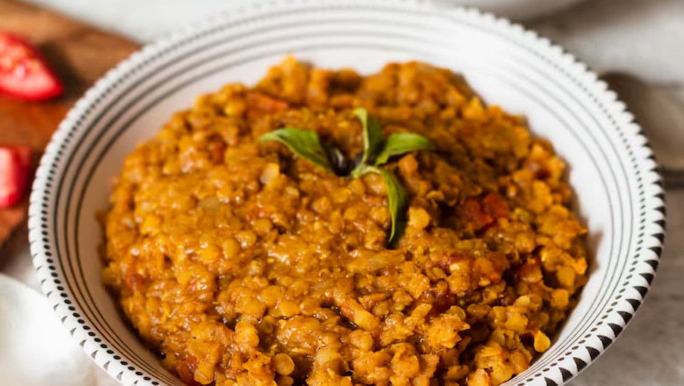 Bowl of lentil curry with garnish