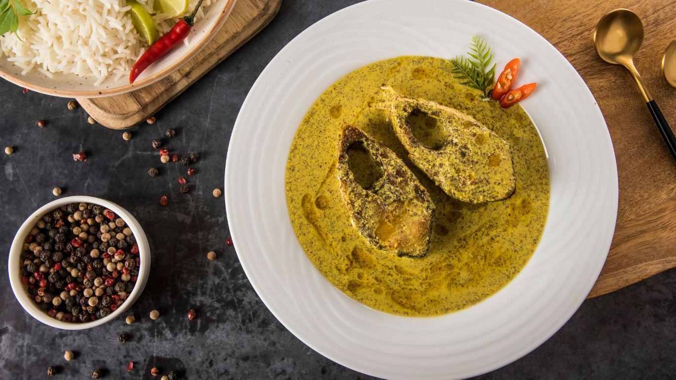 Traditional fish curry with rice and spices
