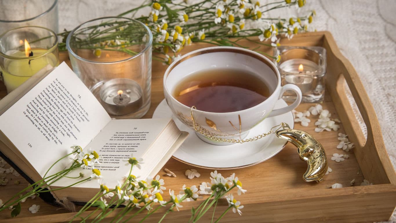 Cozy tea tray with open book