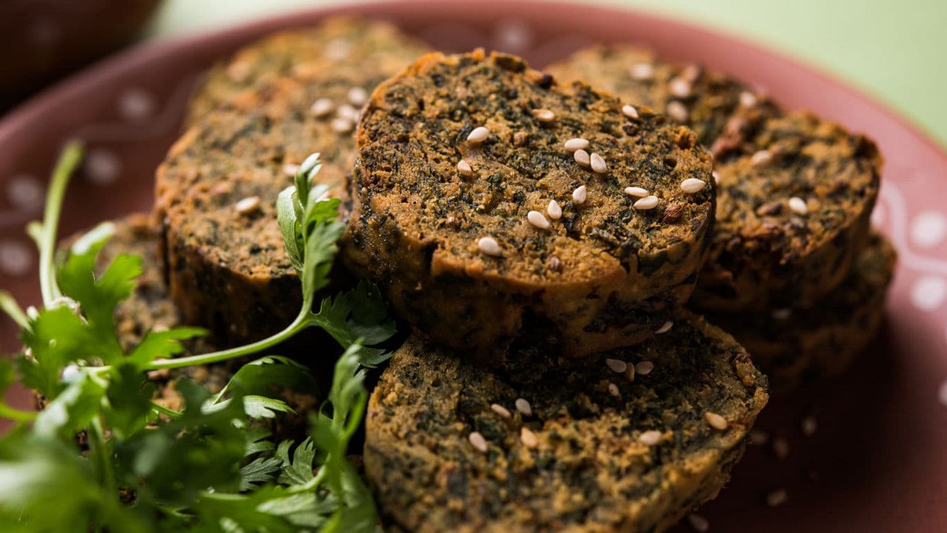 Herb-crusted savory snack slices on plate