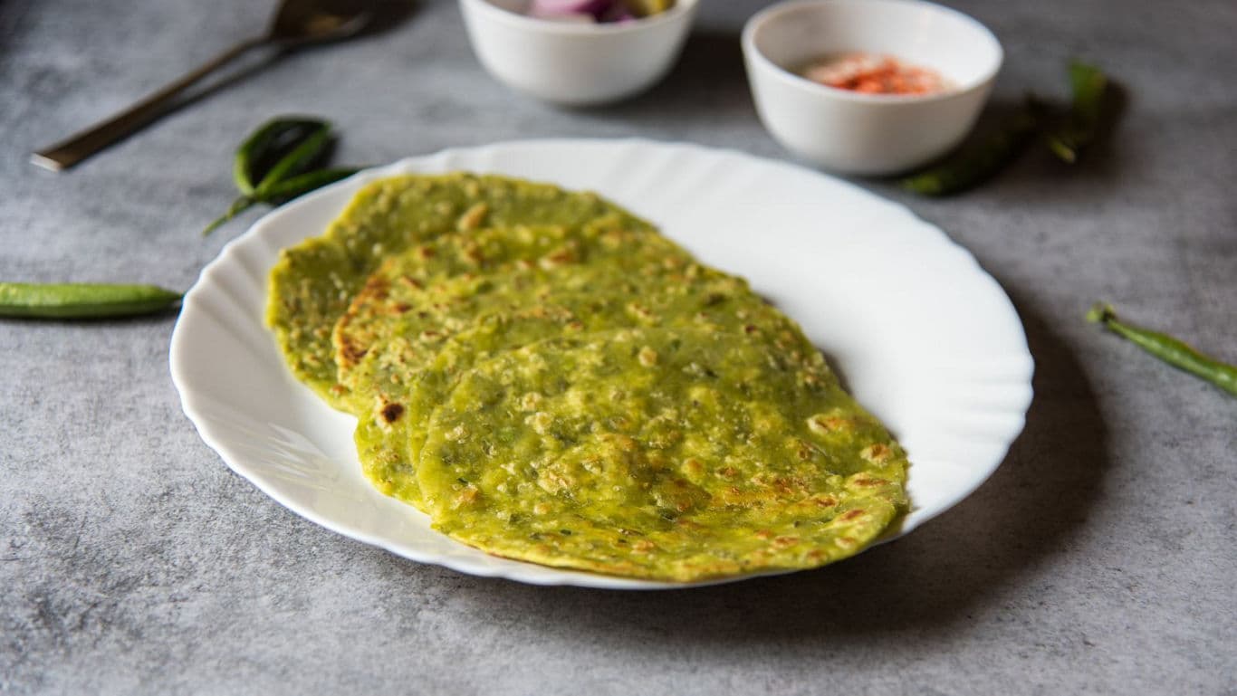 Green savory flatbreads served on white plate
