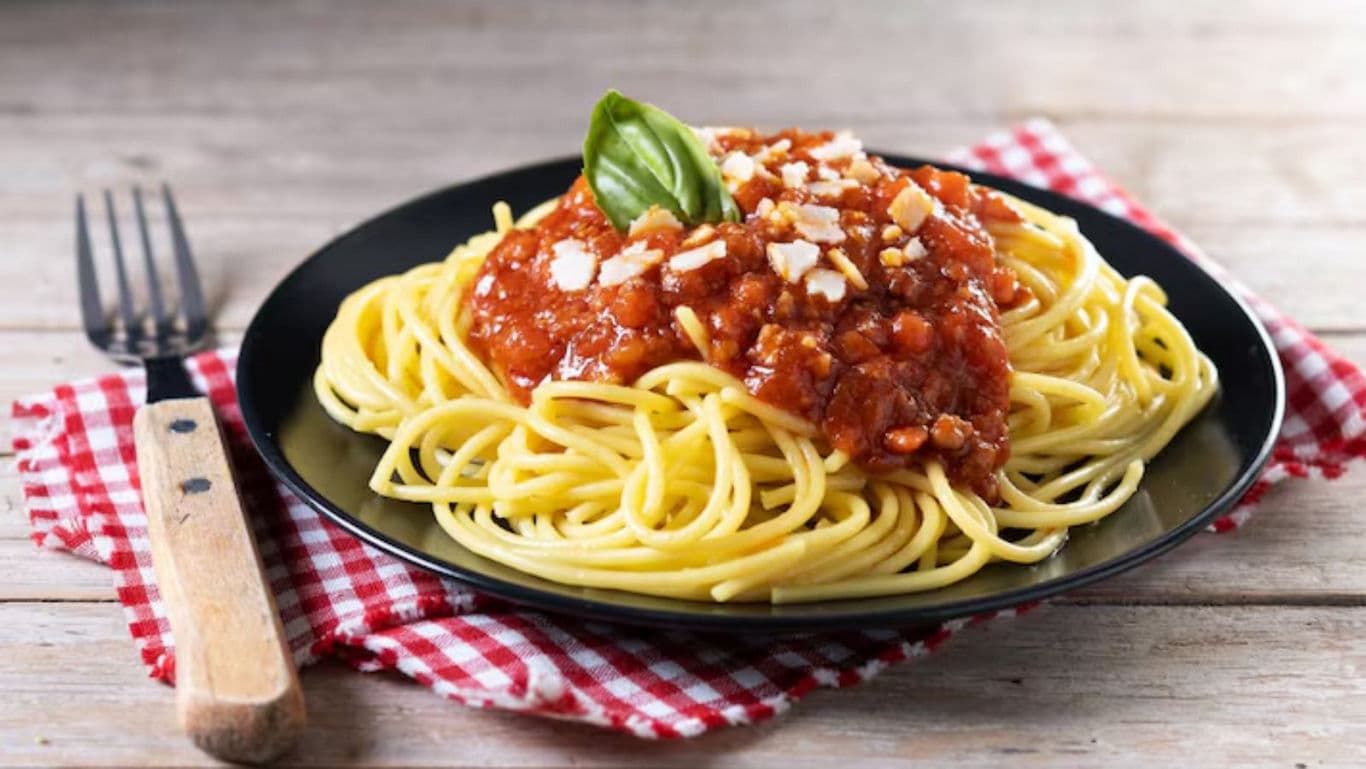 Classic Spaghetti with Tomato Sauce and Basil Garnish