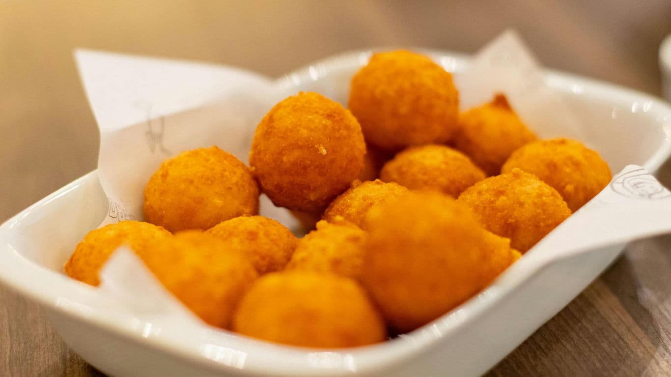 Golden Fried Cheese Balls in White Dish