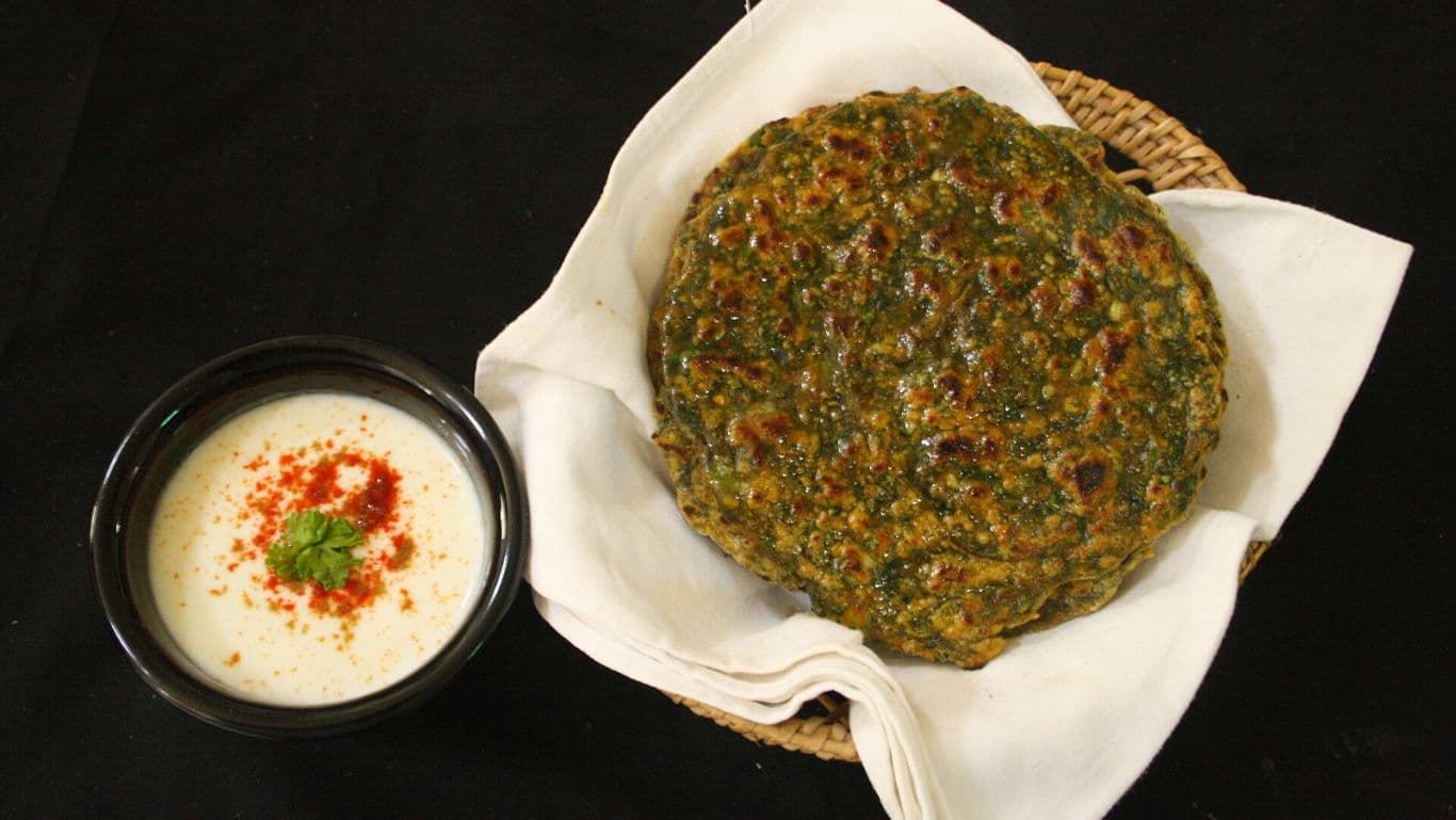 Traditional Indian flatbread with spiced yogurt dip
