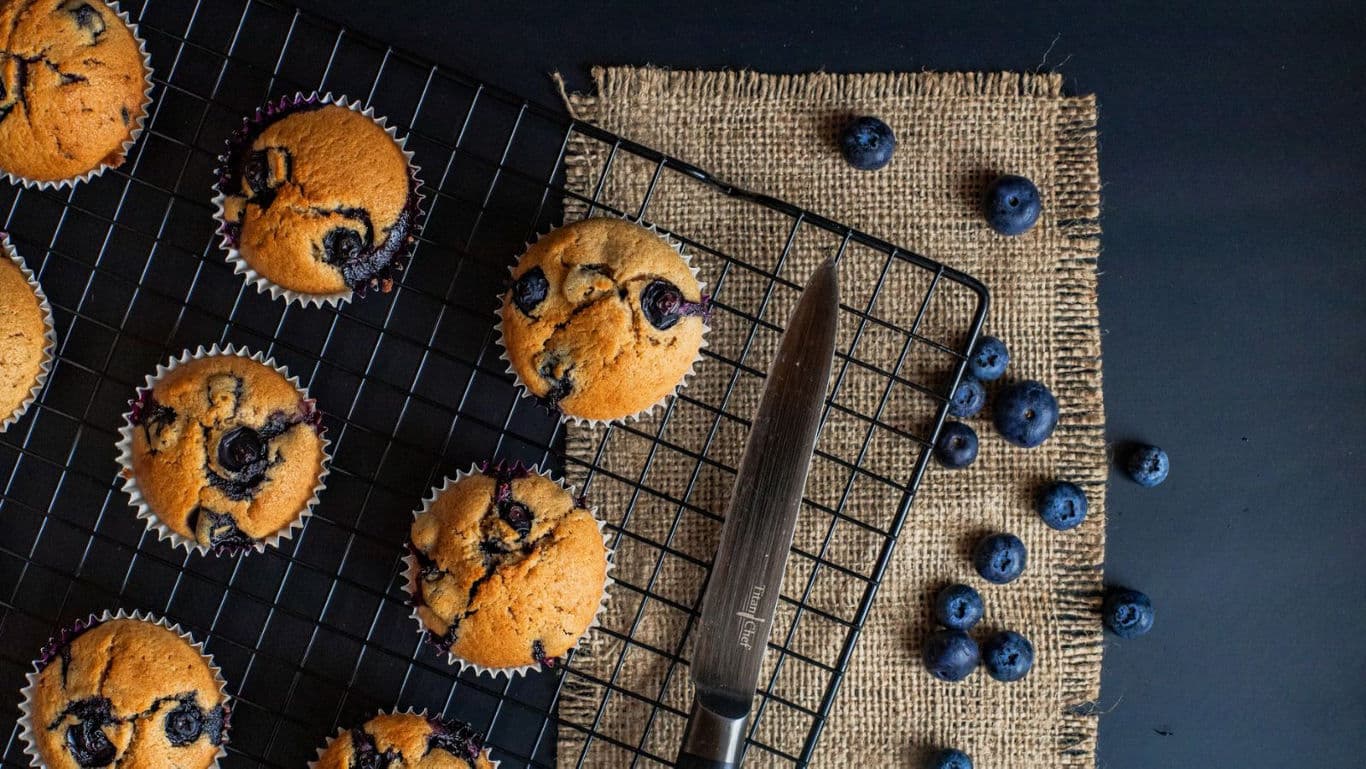 Freshly Baked Blueberry Muffins on Cooling Rack