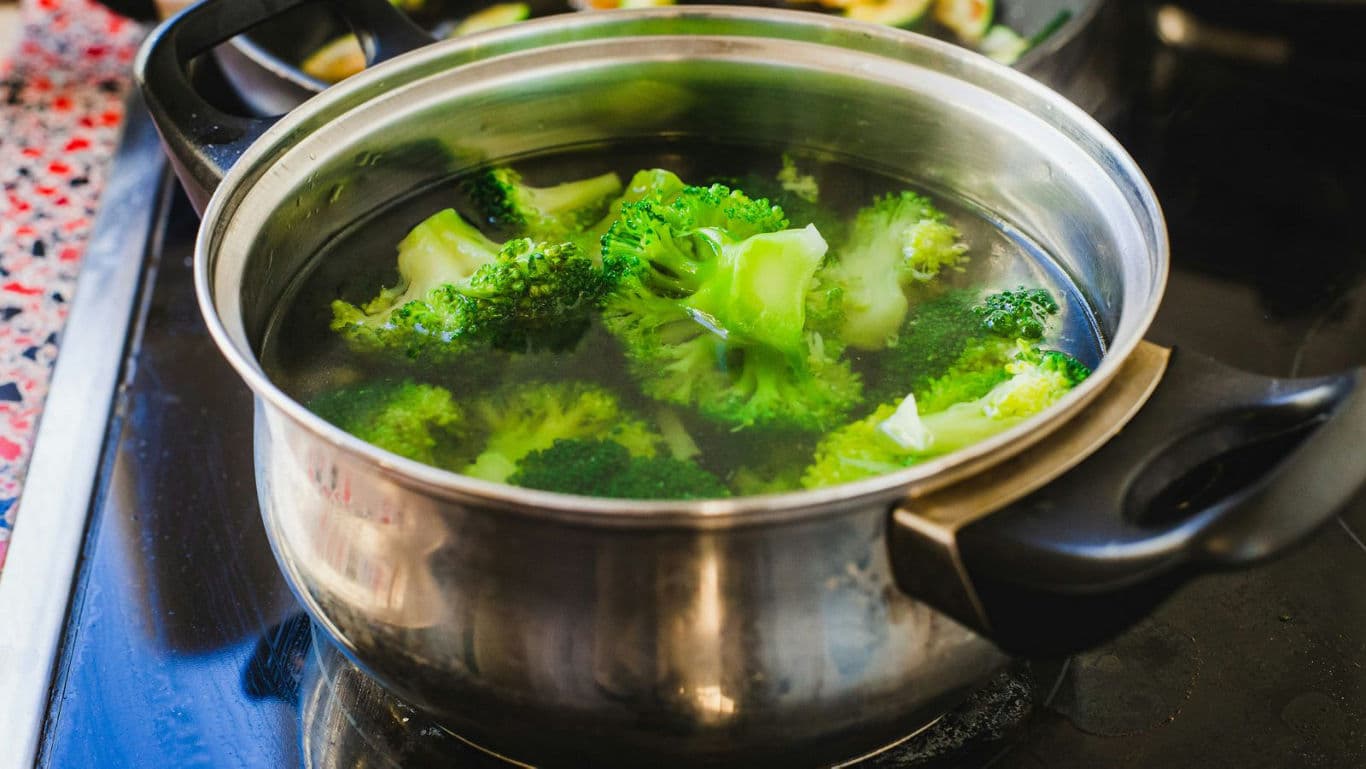 Fresh broccoli boiling in stainless steel pot