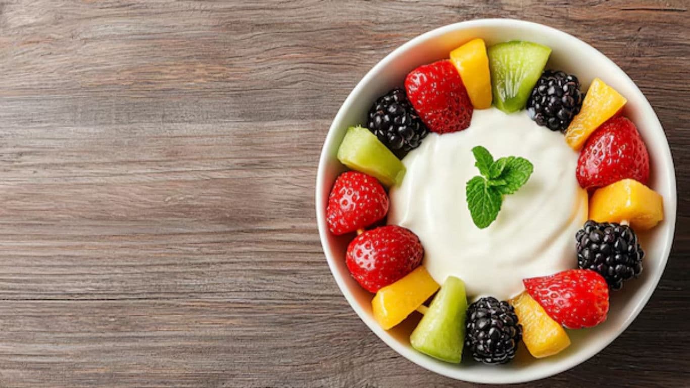 Bowl of yogurt with fresh mixed fruit