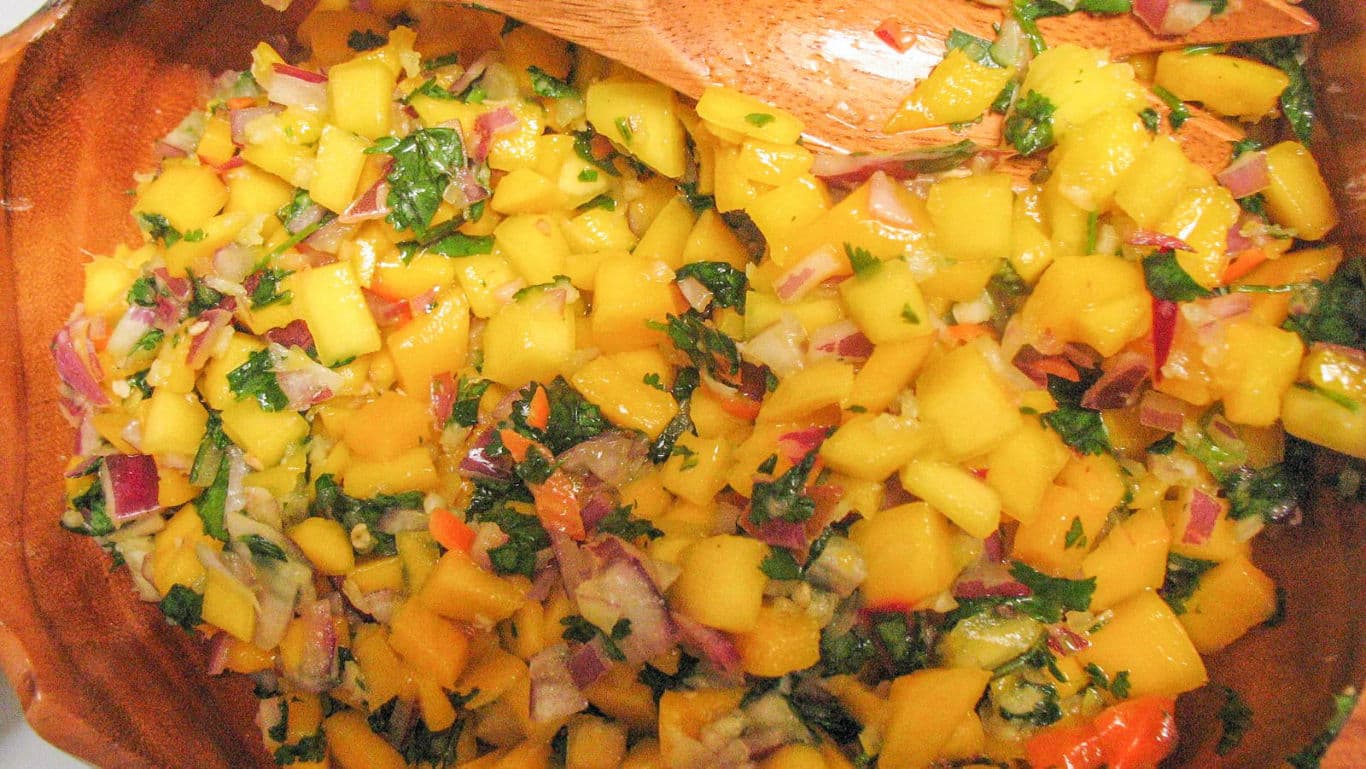 Fresh Mango Salsa in Wooden Bowl with Spoon