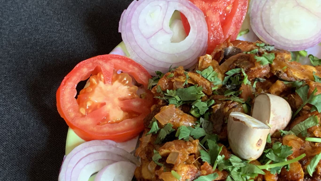 Spiced Vegetable Curry Garnished with Fresh Herbs