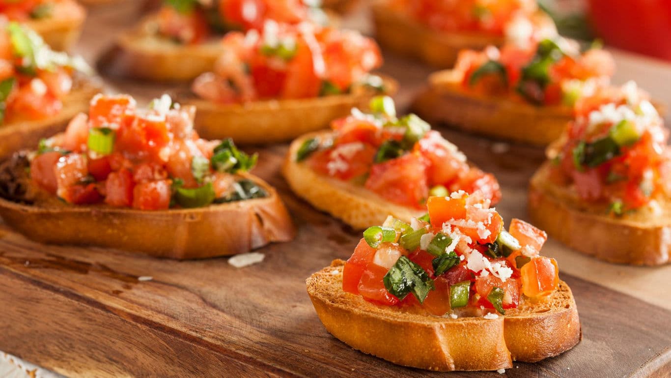 Fresh Tomato Bruschetta Appetizers on Wooden Board