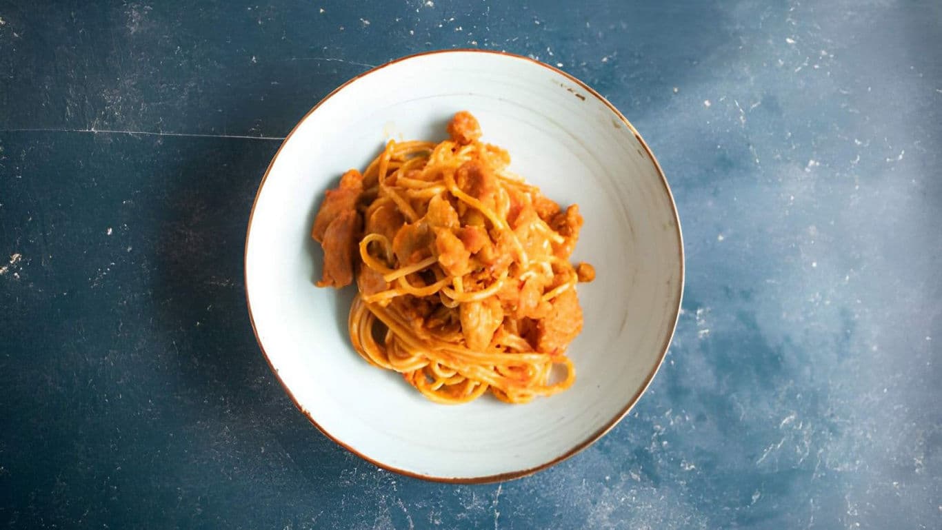 Creamy Pasta with Chicken on Blue Tabletop