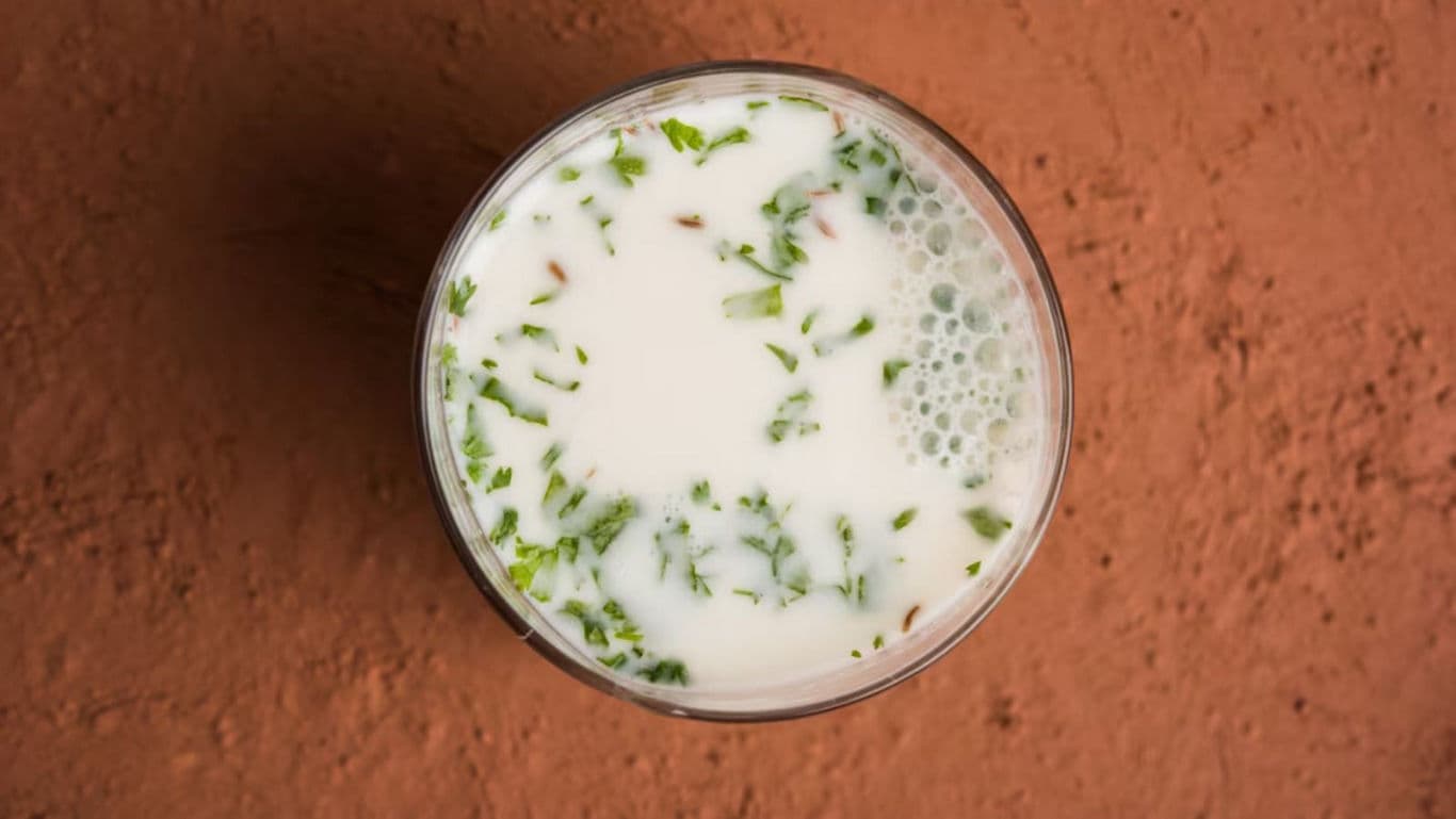 Glass of Spiced Buttermilk with Fresh Herbs
