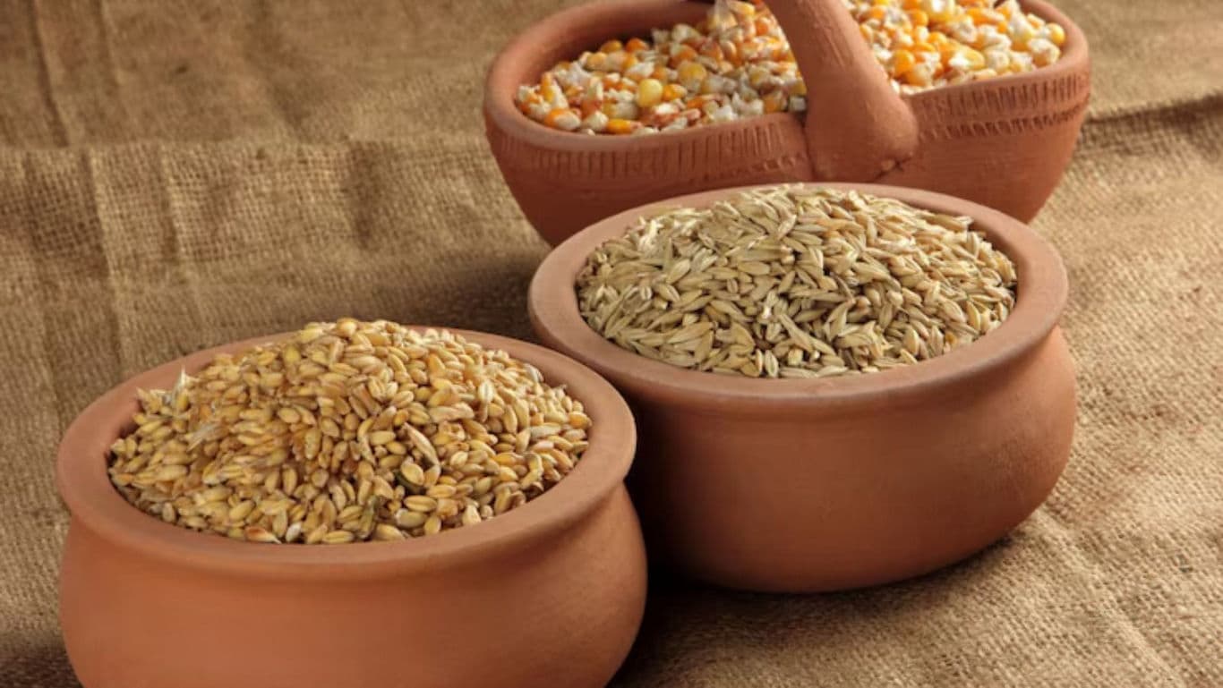 Assorted Grains in Traditional Clay Pots on Burlap