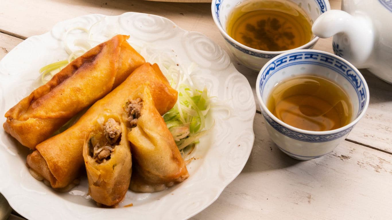Crispy spring rolls served with hot tea