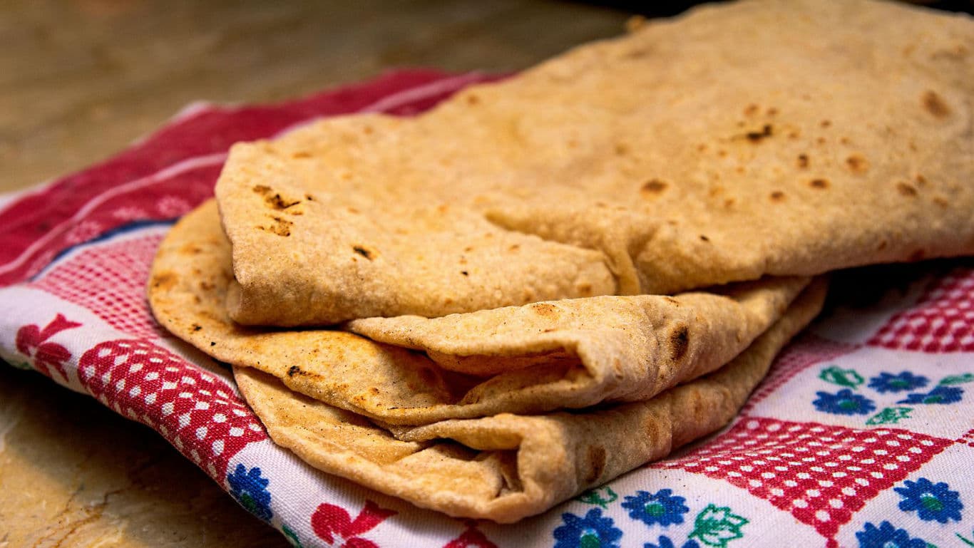 Freshly Cooked Flatbreads on Patterned Cloth