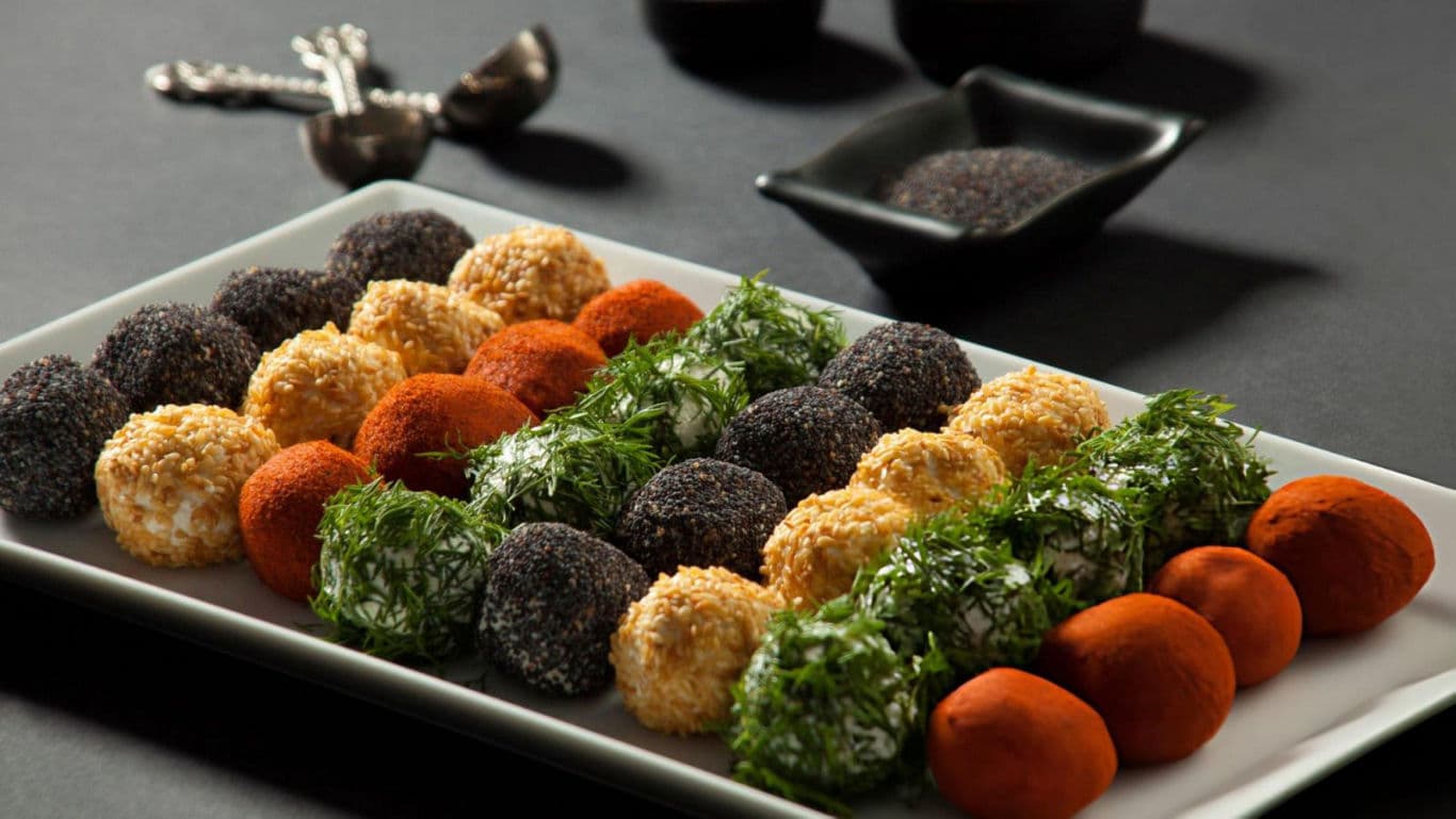 Assorted cheese balls on serving tray