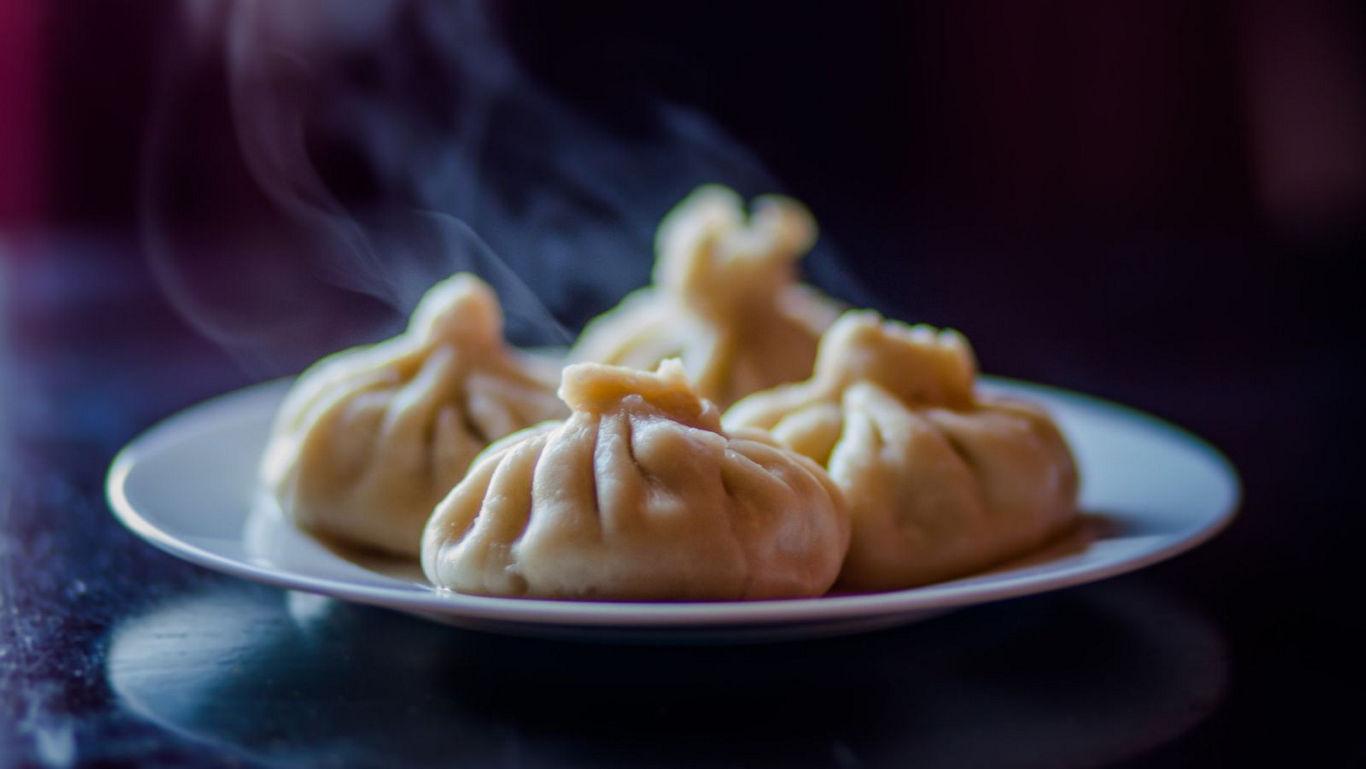 Steaming hot dumplings on a plate