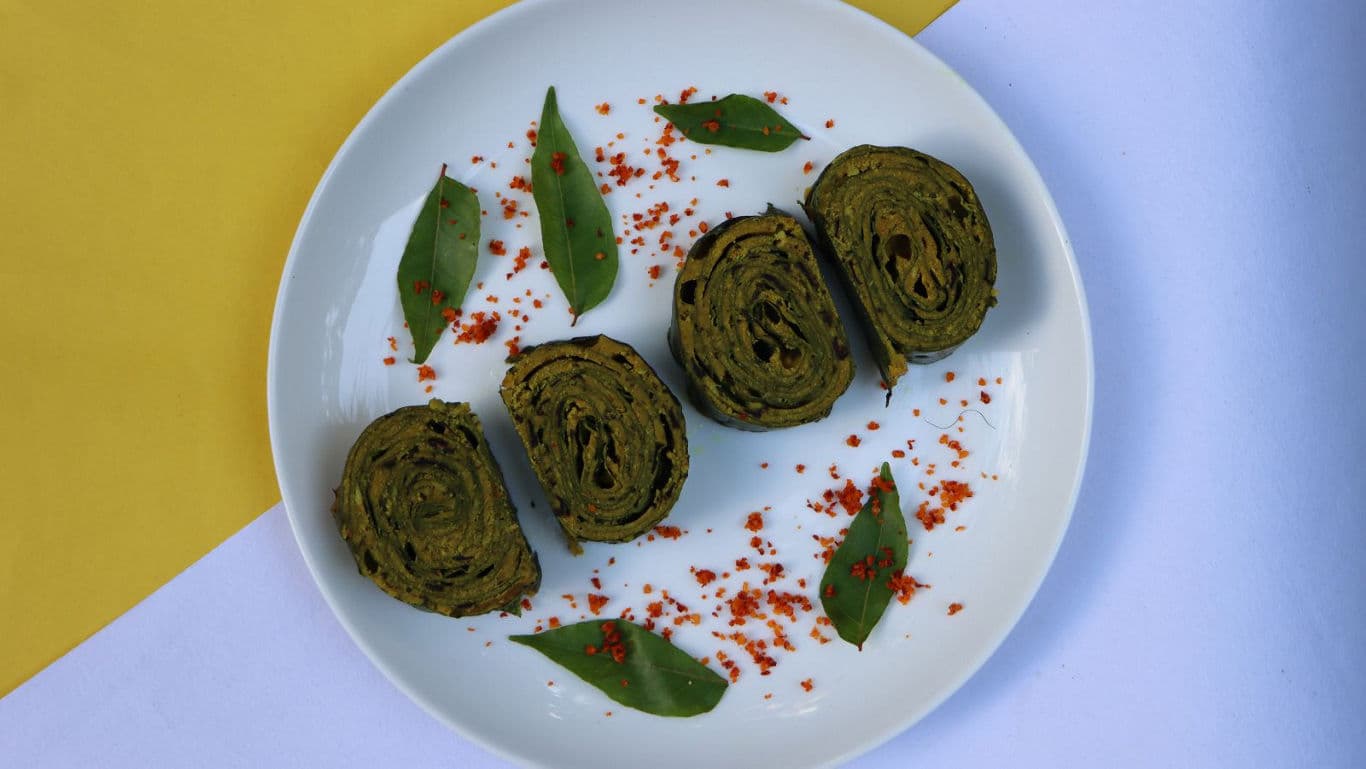 Spiced green snack rolls on plate