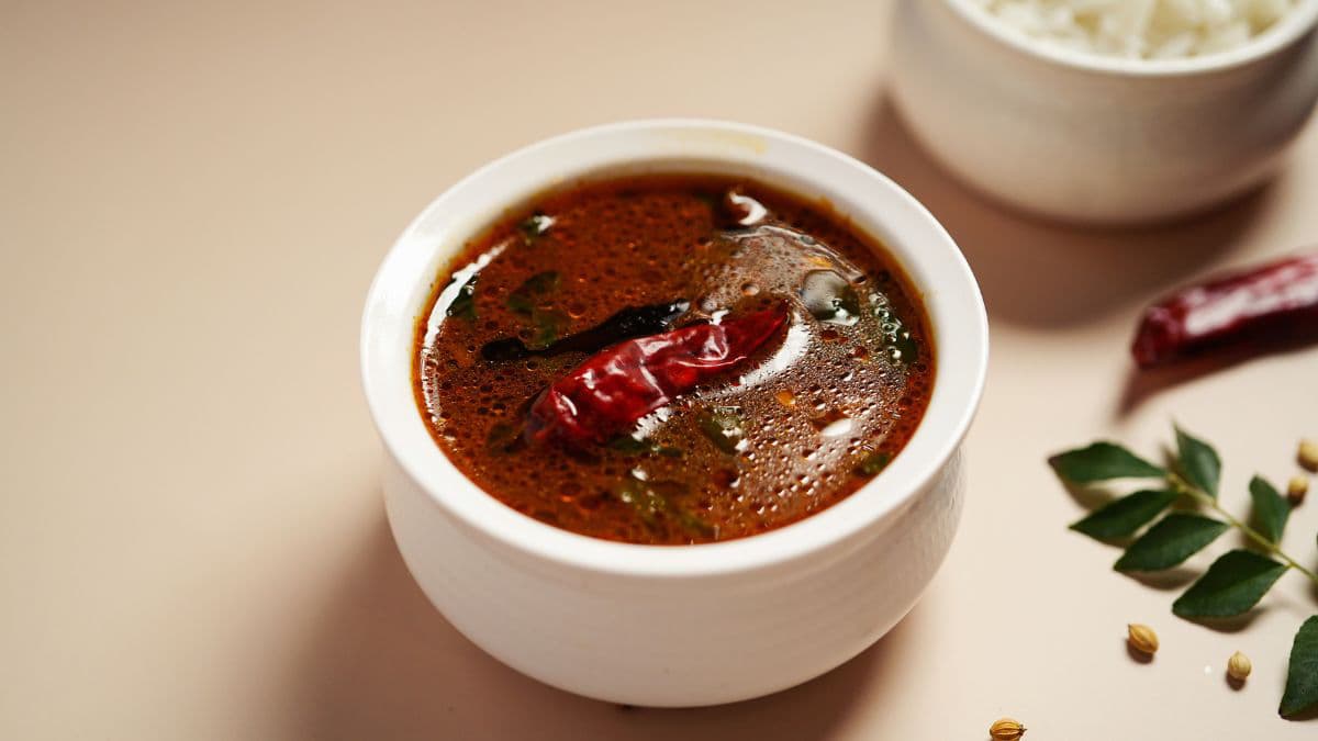 Rasam in a white bowl