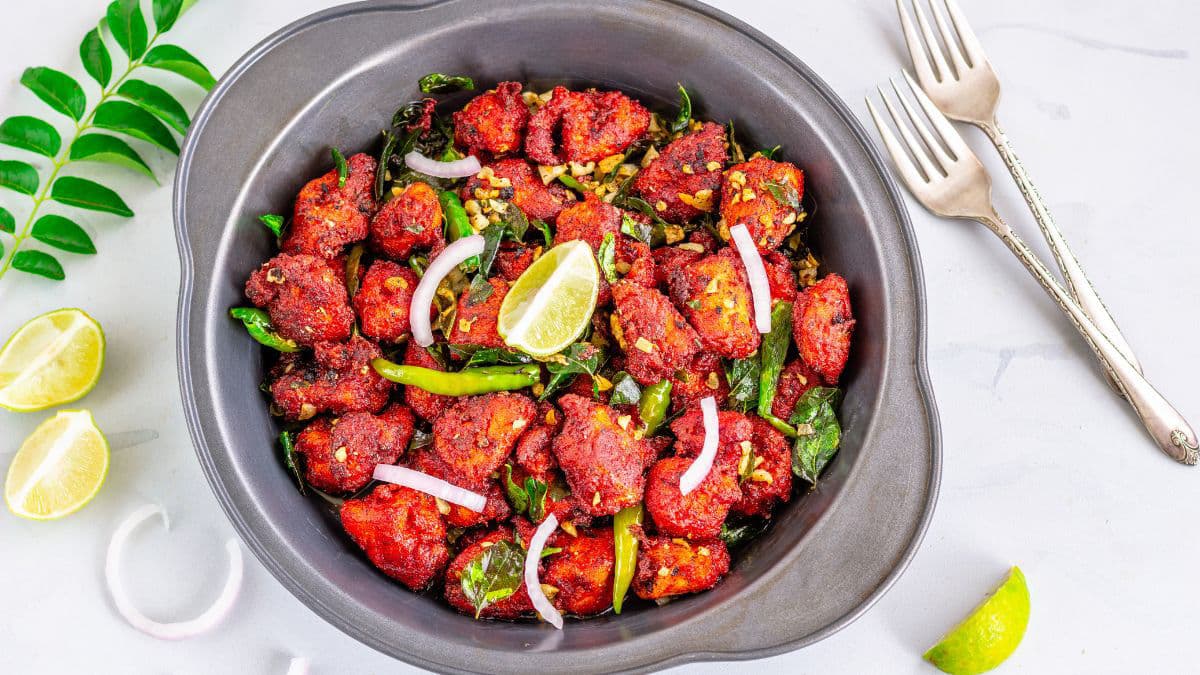 Chicken 65 in a black pot