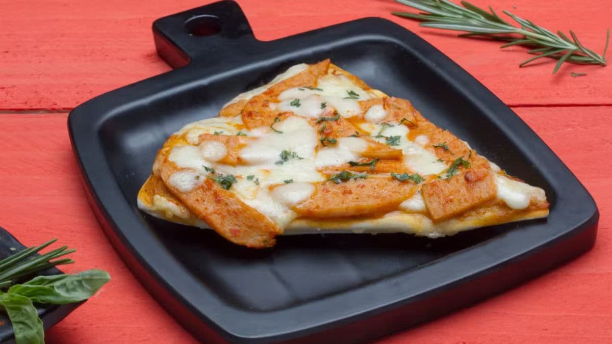 Chicken pizza slice on a plate
