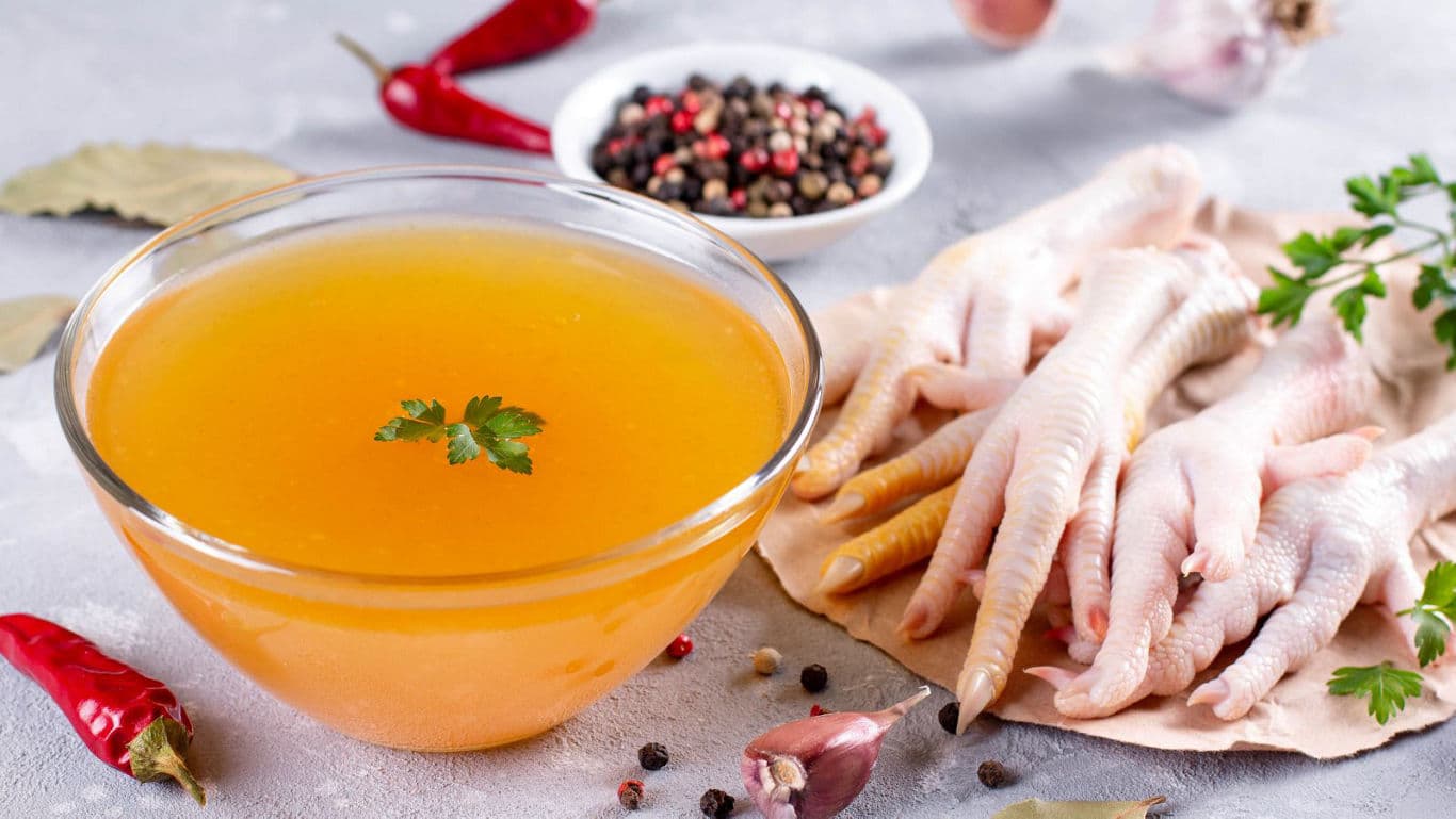 Chicken Feet Broth with Spices on Table