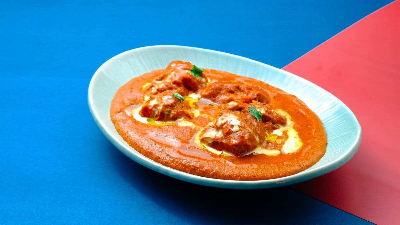Creamy Indian curry served in white bowl